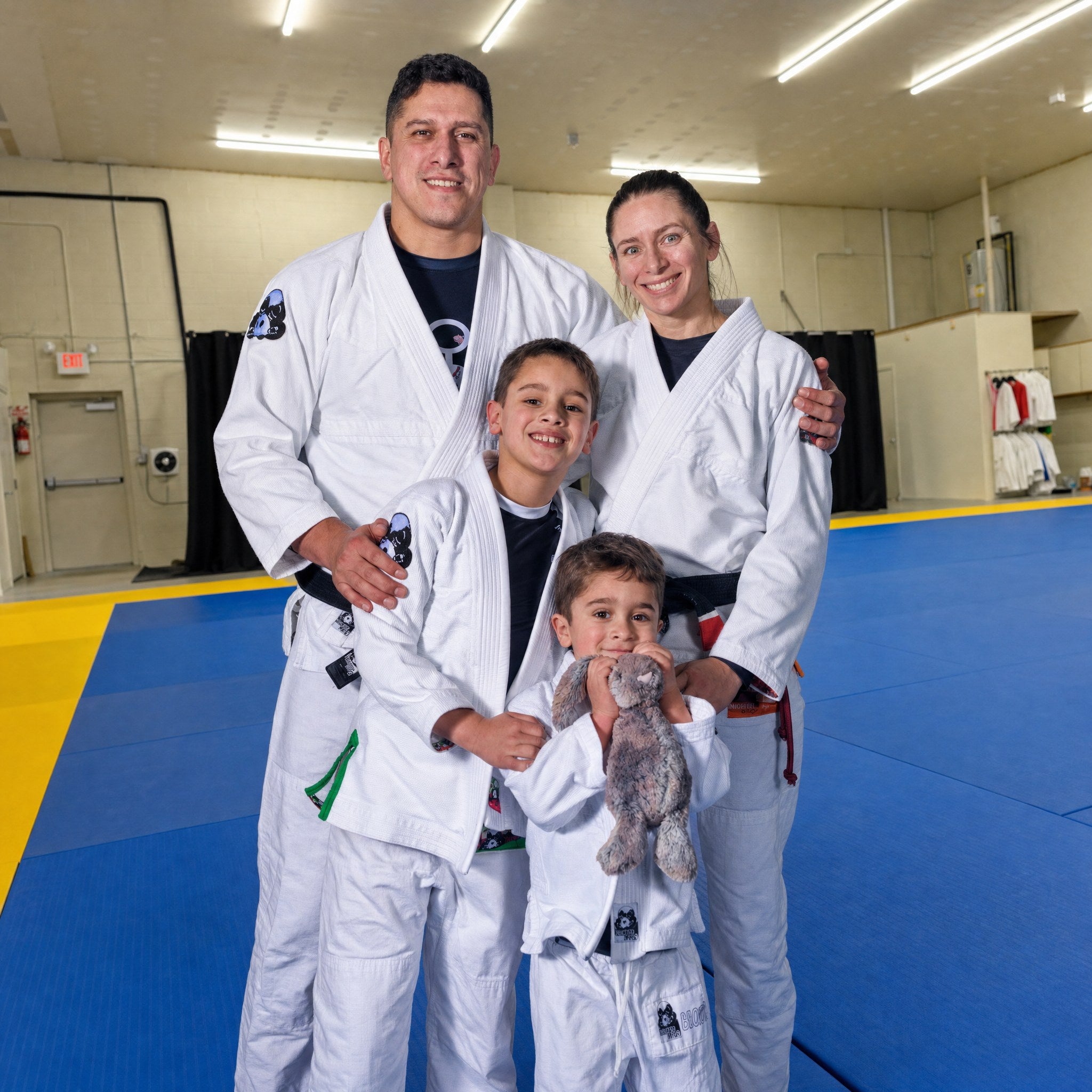 Nelson and Hillary with their two sons on the mats at Inverted Gear Academy